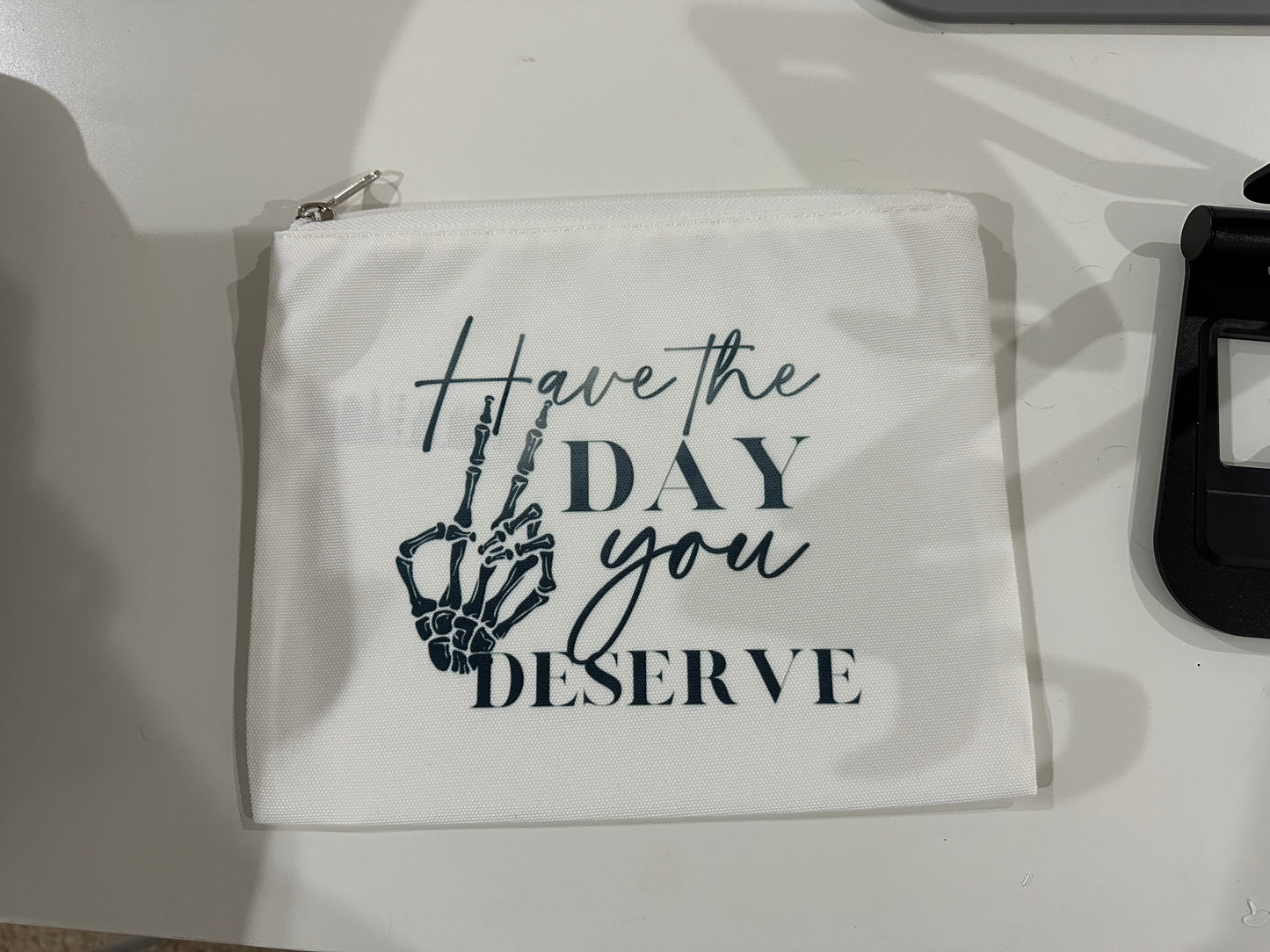 Have the Day You Deserve zip pouch